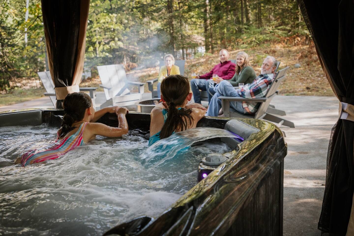 Family in the hot tub at Seven Pines Chalet